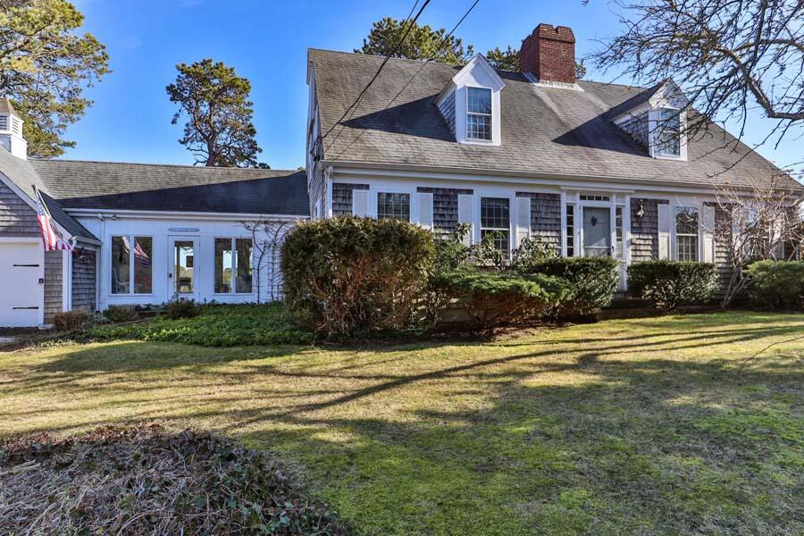 17 Soundview Road Harwich, MA 02645 - Photo 2 of 37 a front view of a house with a garden