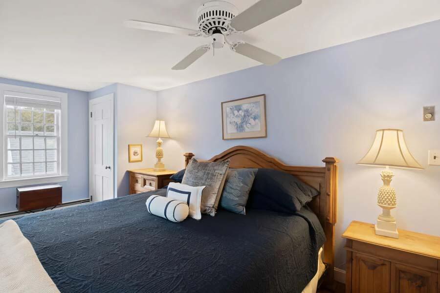 17 Soundview Road Harwich, MA 02645 - Photo 26 of 37 a bed sitting in a bedroom and chair next to a window