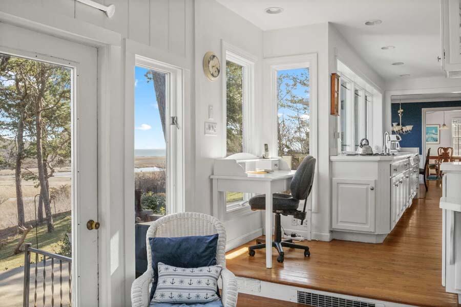 17 Soundview Road Harwich, MA 02645 - Photo 9 of 37 a view of a kitchen with dining table and chairs