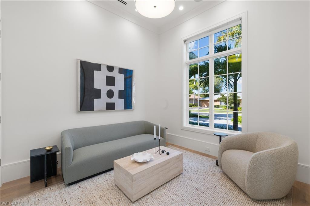 660 Wedge Drive Naples, FL 34103 - Photo 18 of 22 a living room with furniture and a window