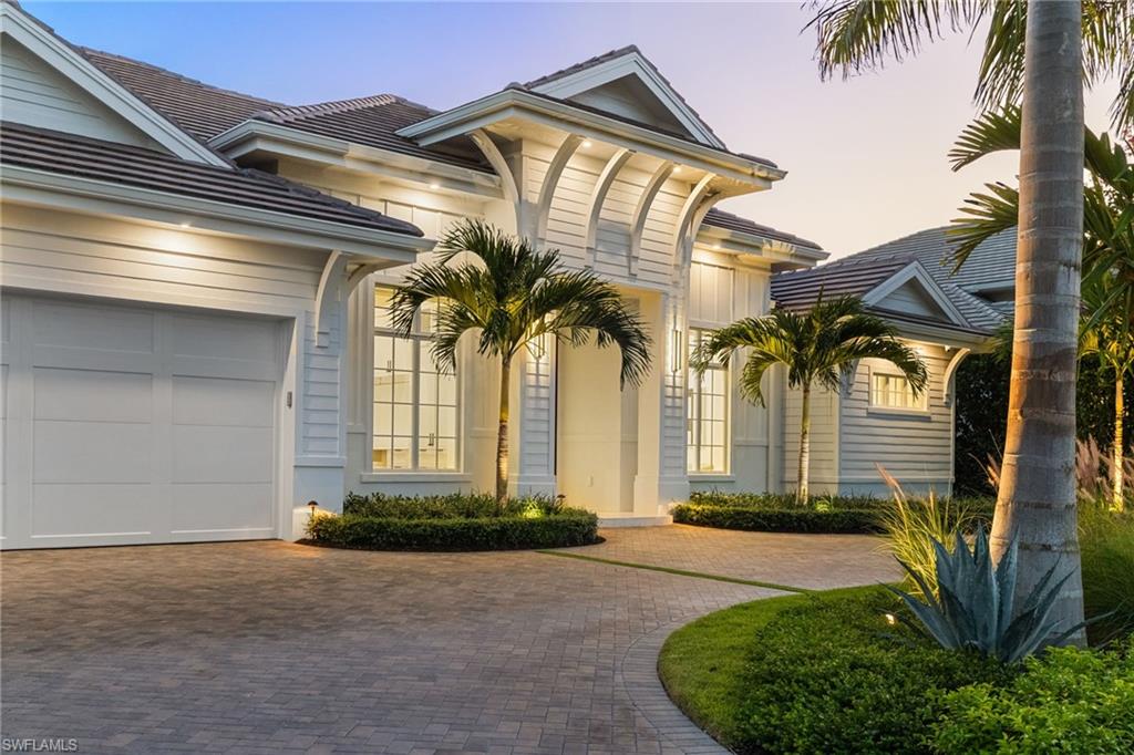 660 Wedge Drive Naples, FL 34103 - Photo 21 of 22 a front view of a house having yard