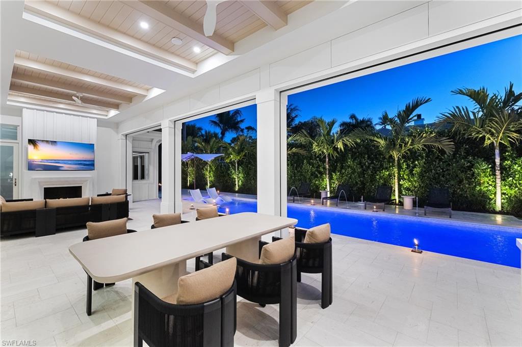 660 Wedge Drive Naples, FL 34103 - Photo 3 of 22 a view of a livingroom with furniture and window
