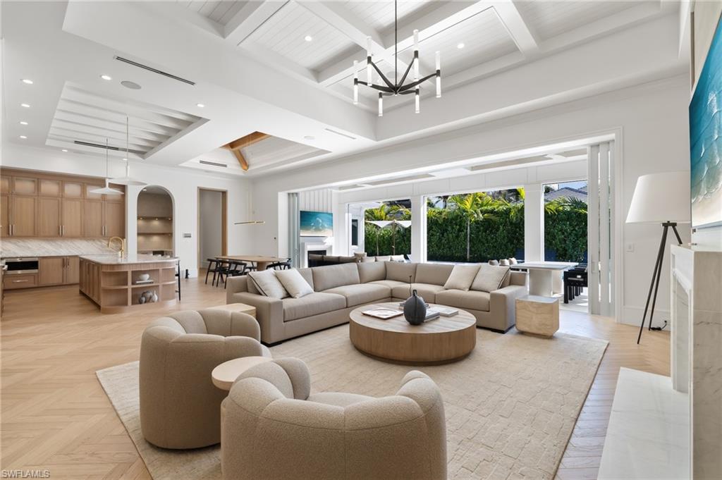 660 Wedge Drive Naples, FL 34103 - Photo 4 of 22 a living room with furniture and a large window