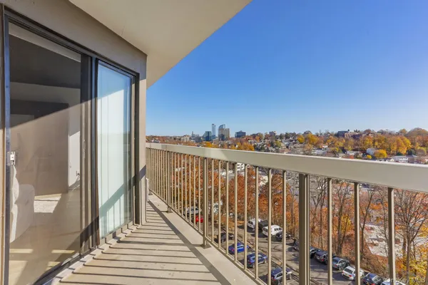 a view of a balcony with city view