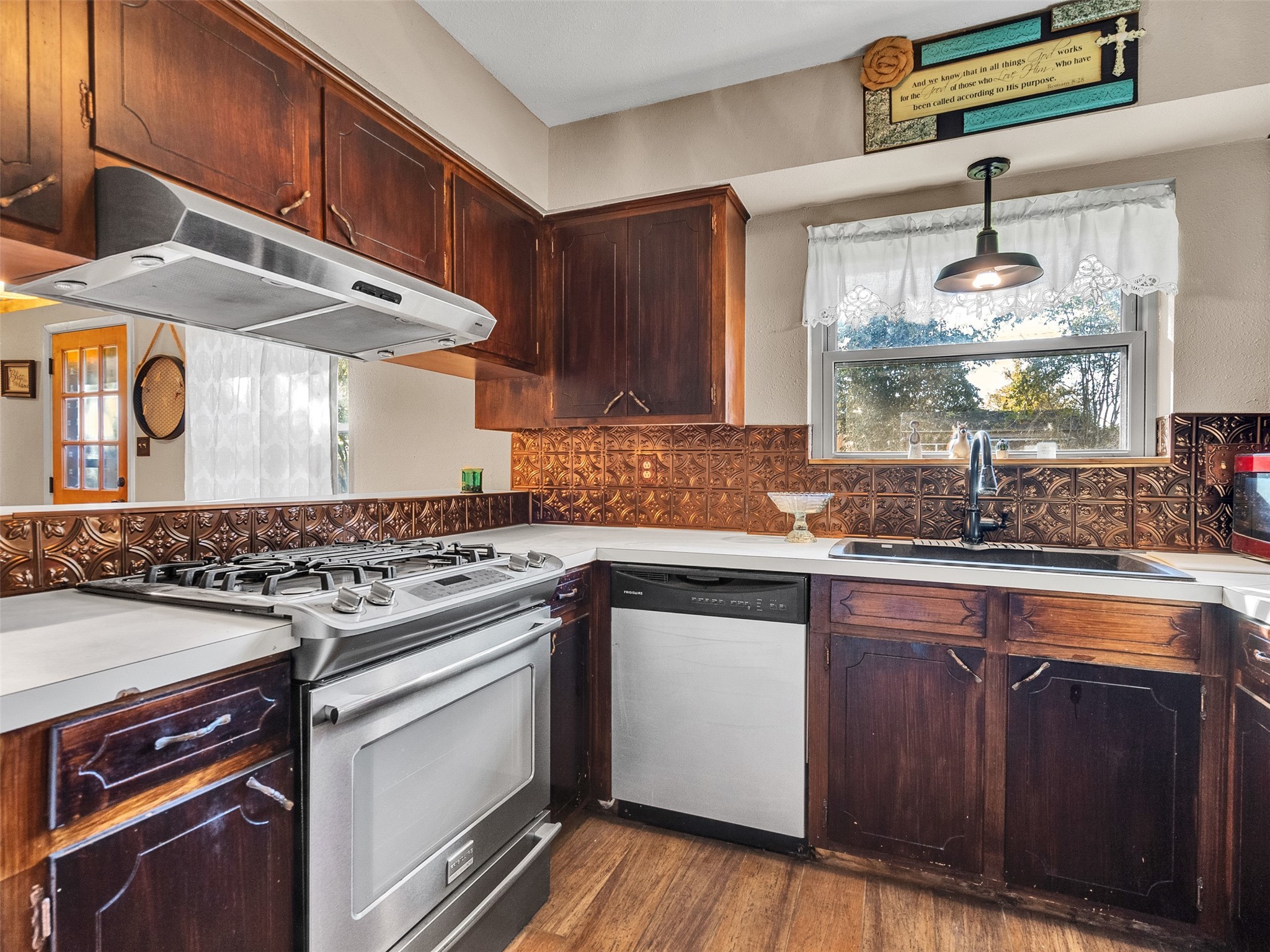 730 Broad Ripple Drive Houston, TX 77336 - Photo 11 of 28 a kitchen with stainless steel appliances granite countertop a stove and a sink