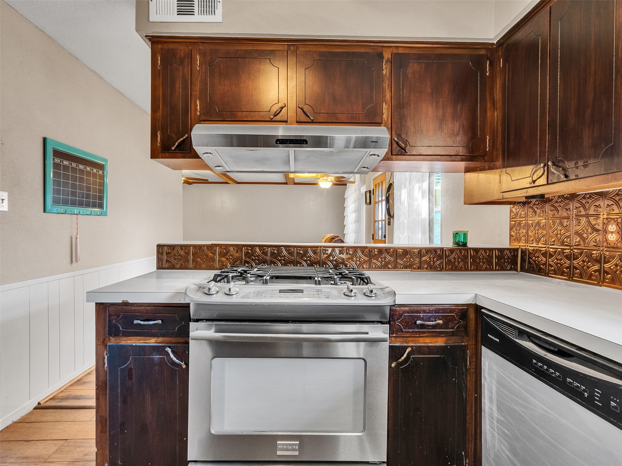 730 Broad Ripple Drive Houston, TX 77336 - Photo 12 of 28 a kitchen with a stove and a microwave
