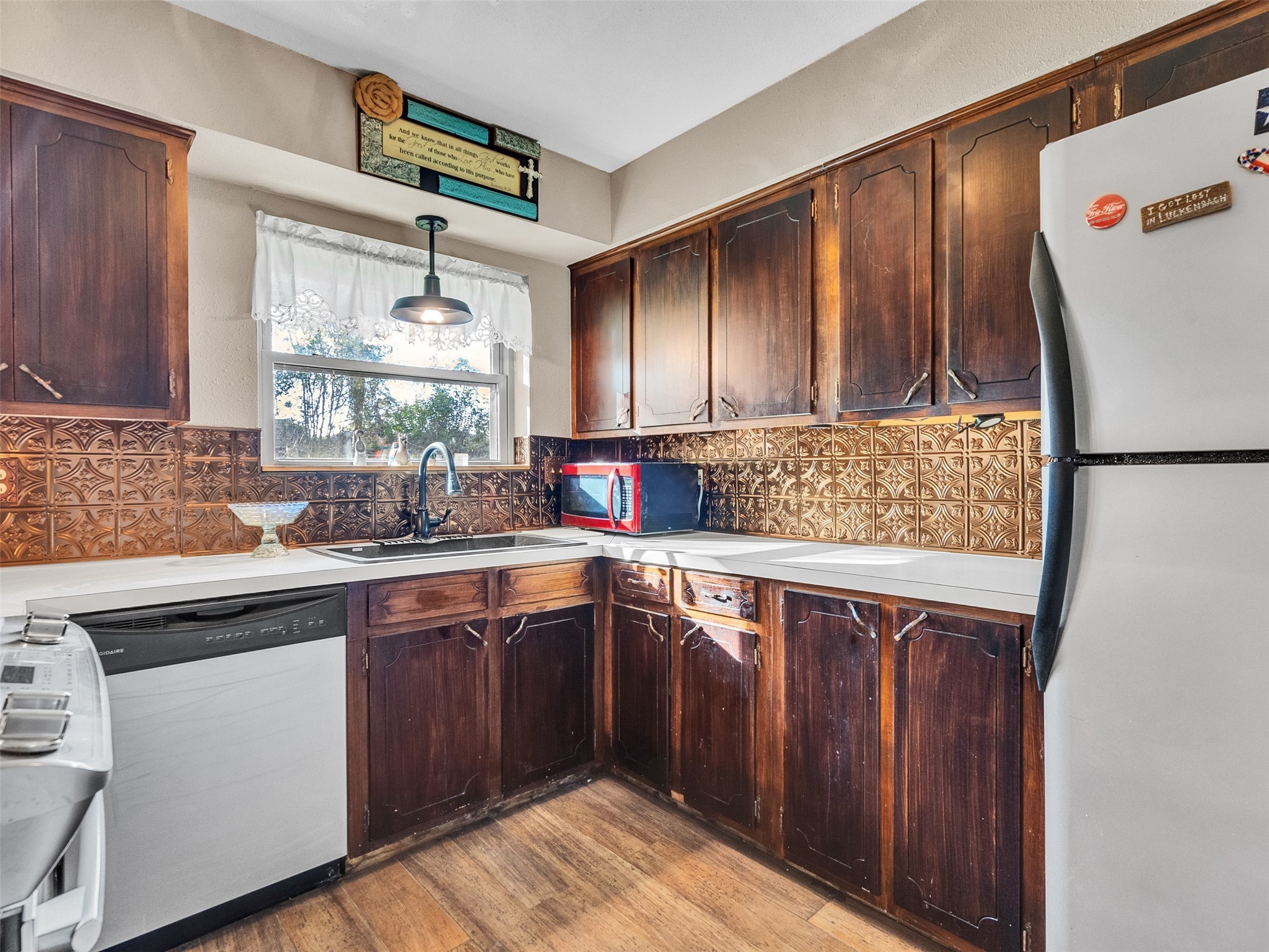 730 Broad Ripple Drive Houston, TX 77336 - Photo 13 of 28 a kitchen with stainless steel appliances granite countertop a sink stove and refrigerator
