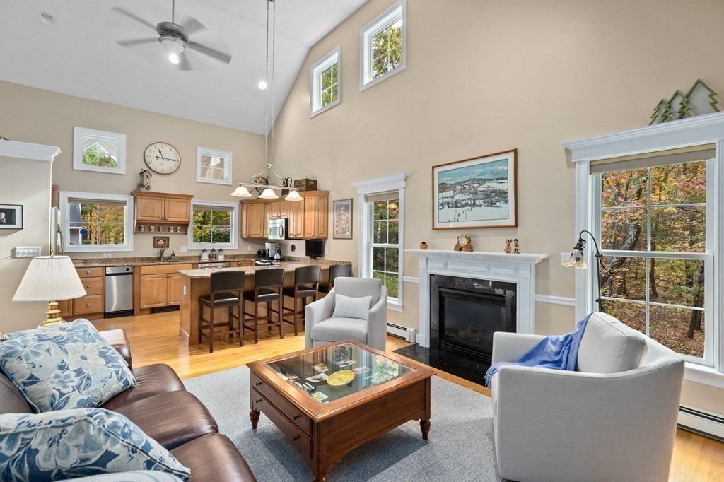 17 Summersweet Circle, Unit 22 Hanover, MA 02339 - Photo 16 of 42 a living room with furniture fireplace and a large window