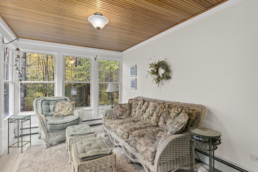 17 Summersweet Circle, Unit 22 Hanover, MA 02339 - Photo 23 of 42 a living room with furniture and a large window