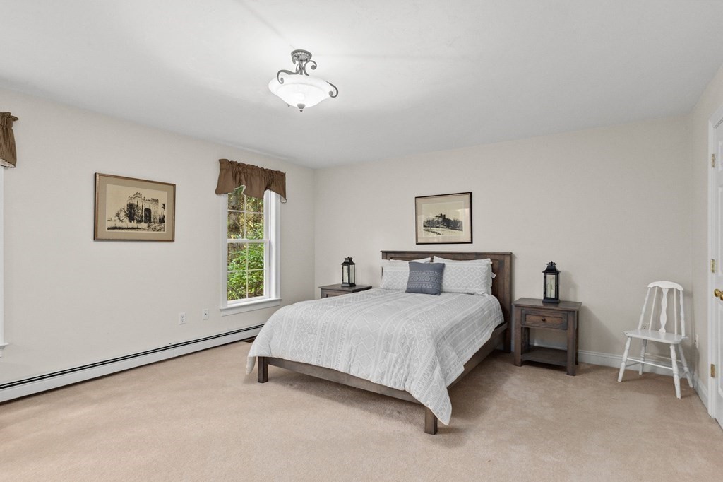 17 Summersweet Circle, Unit 22 Hanover, MA 02339 - Photo 26 of 42 a bedroom with a bed and a window