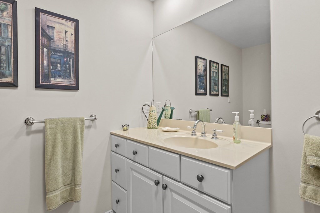 17 Summersweet Circle, Unit 22 Hanover, MA 02339 - Photo 28 of 42 a bathroom with a sink and a mirror