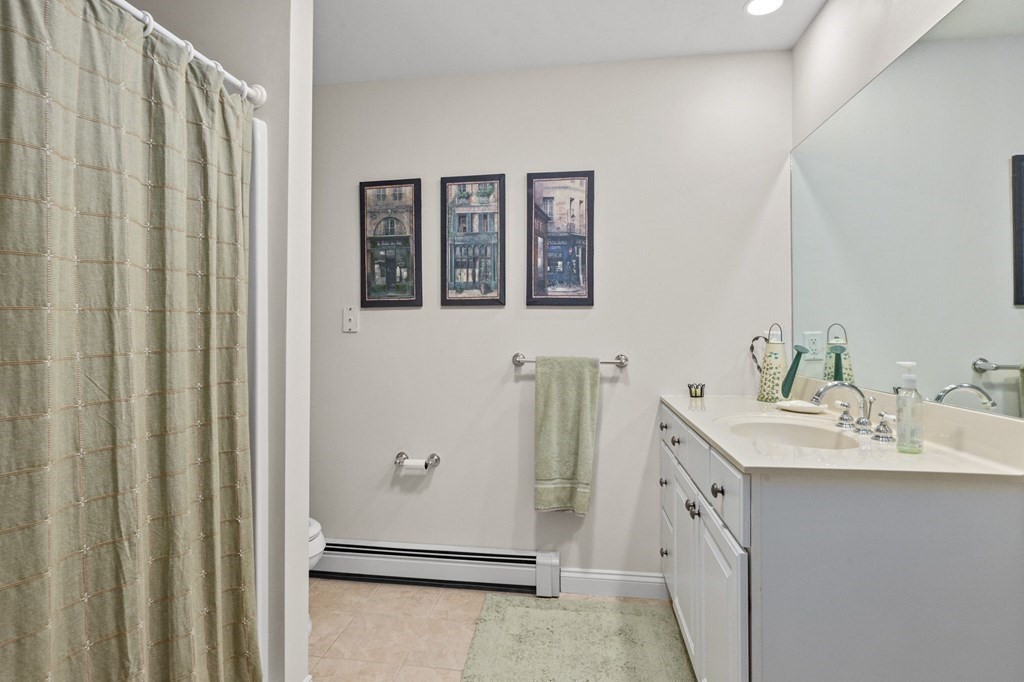 17 Summersweet Circle, Unit 22 Hanover, MA 02339 - Photo 29 of 42 a bathroom with a double vanity sink and a mirror