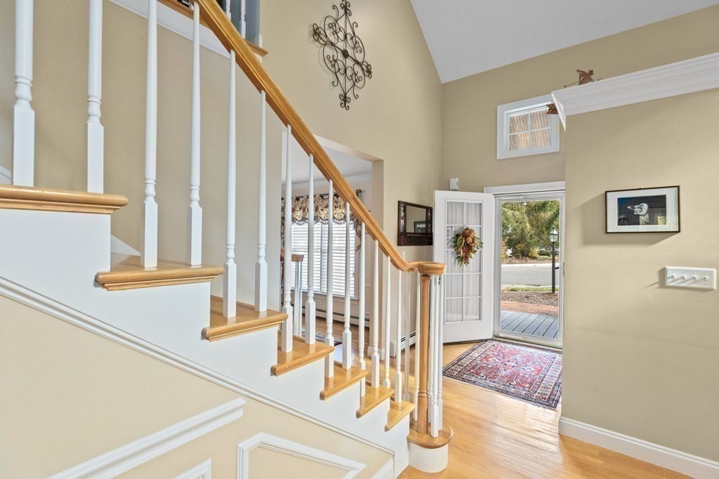 17 Summersweet Circle, Unit 22 Hanover, MA 02339 - Photo 30 of 42 a view of entryway and hall with wooden floor