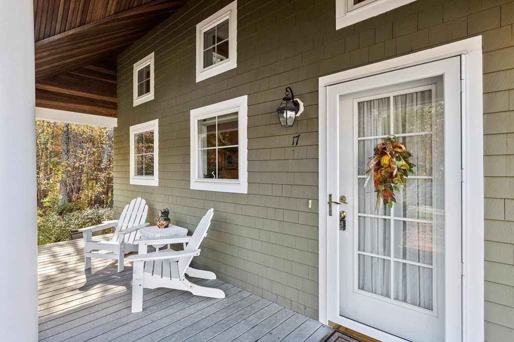 17 Summersweet Circle, Unit 22 Hanover, MA 02339 - Photo 3 of 42 a view of a chair and table in the balcony