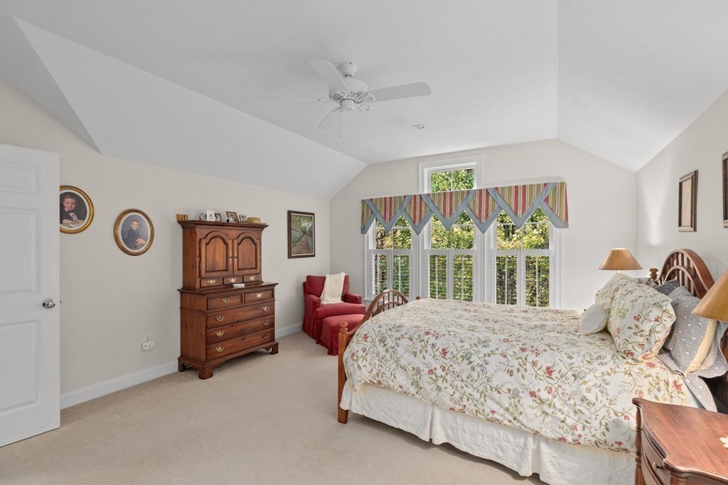 17 Summersweet Circle, Unit 22 Hanover, MA 02339 - Photo 36 of 42 a bedroom with a bed and a large window