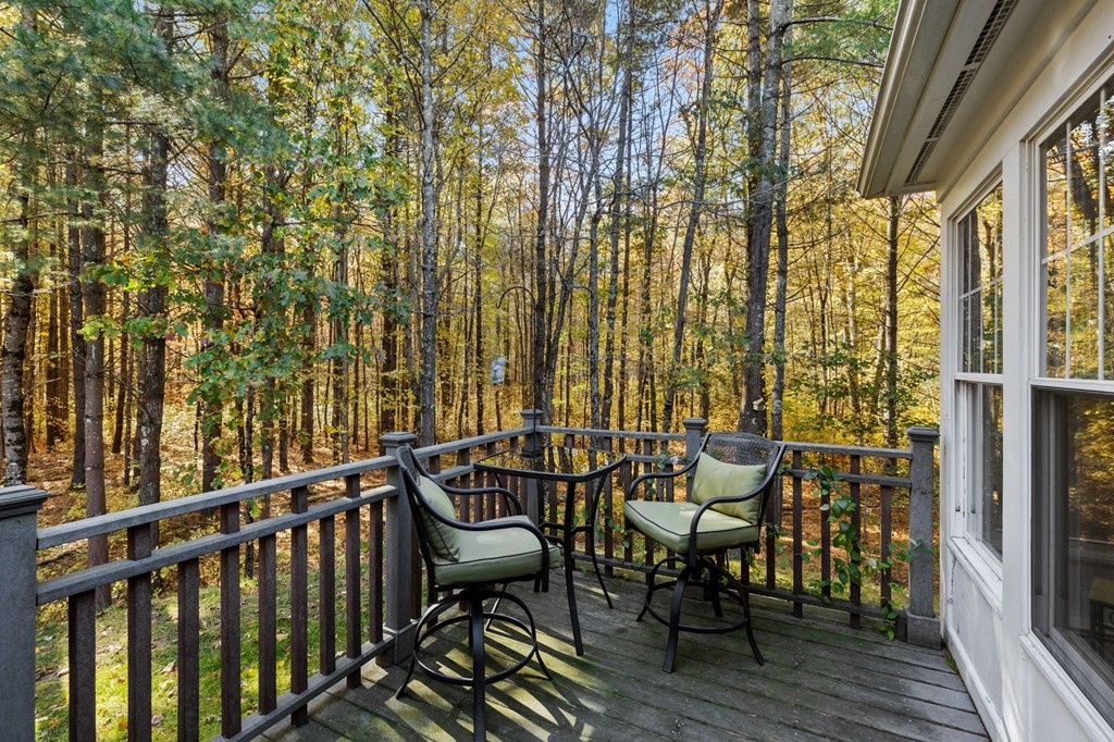 17 Summersweet Circle, Unit 22 Hanover, MA 02339 - Photo 40 of 42 a view of a chairs and table in the balcony