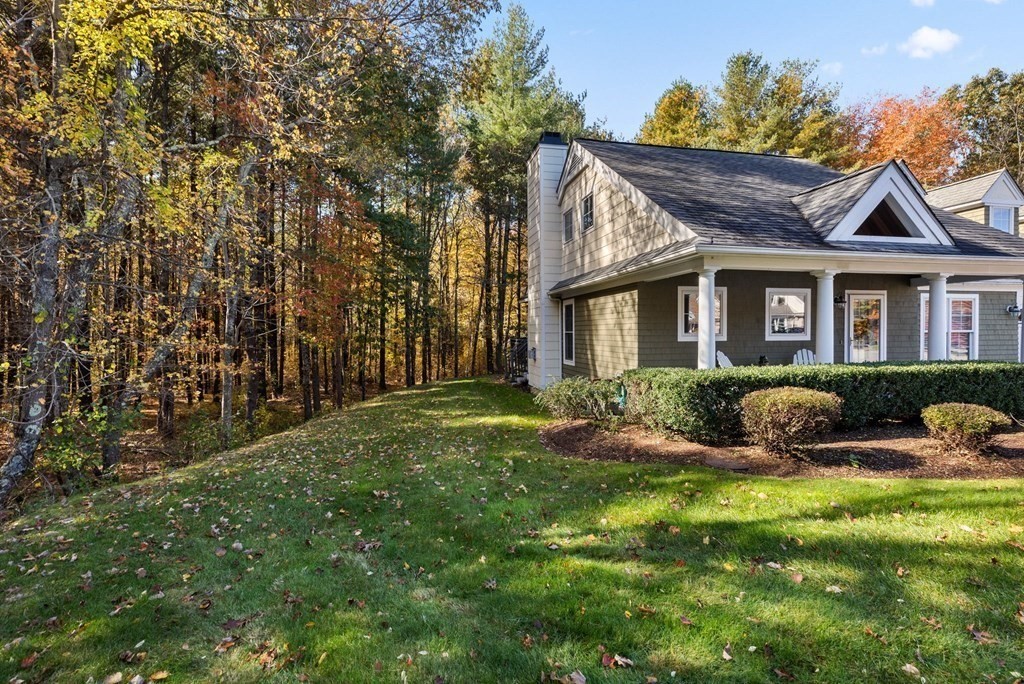 17 Summersweet Circle, Unit 22 Hanover, MA 02339 - Photo 4 of 42 a front view of house with yard and green space