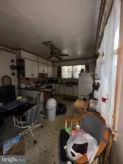 a room with stainless steel appliances kitchen island furniture and stove