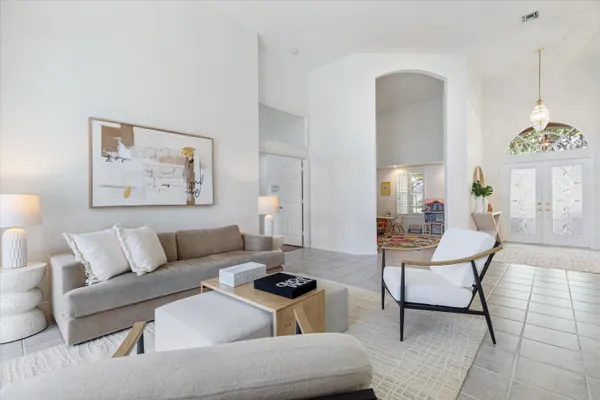 a living room with furniture and a table