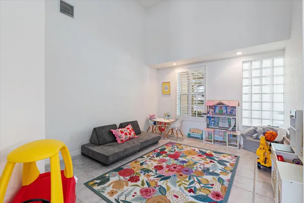 a living room with furniture a rug and a couch