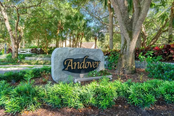 a sign broad in the middle of a park