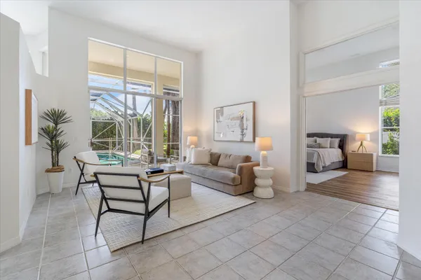 a living room with furniture and a large window