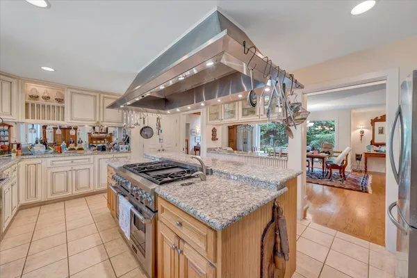 a living room with furniture and floor to ceiling window