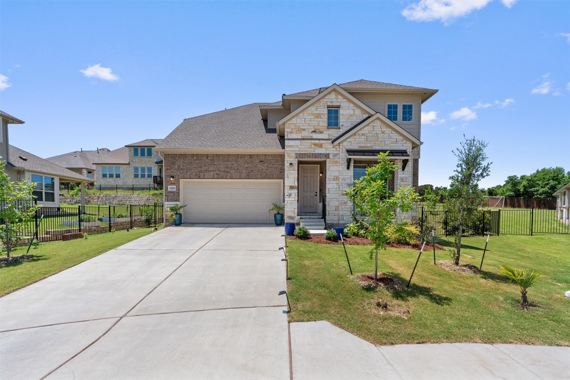 a front view of a house with a yard