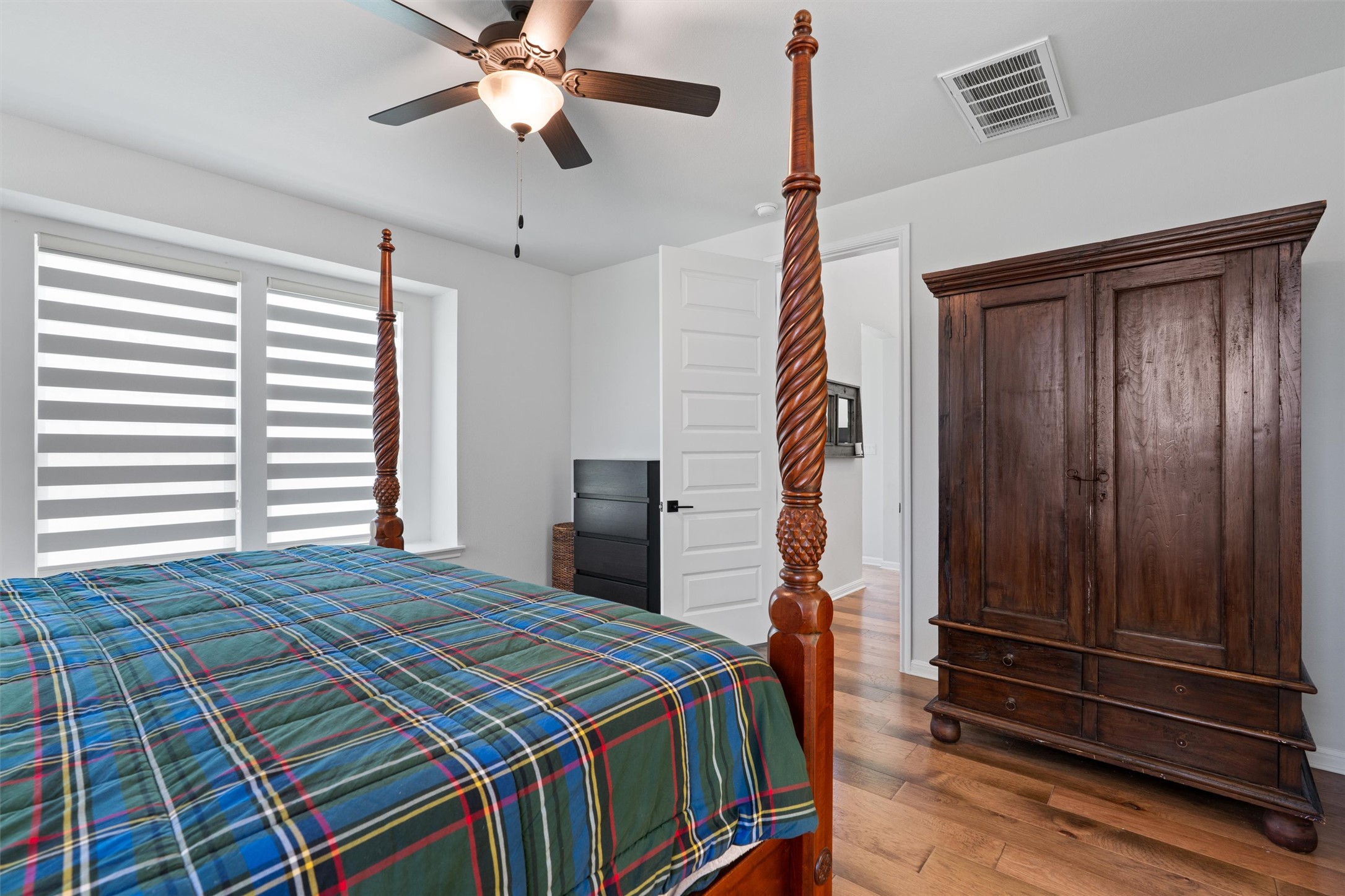 1908 Cabrera Drive Leander, TX 78641 - Photo 17 of 37 a bedroom with a bed and a chandelier