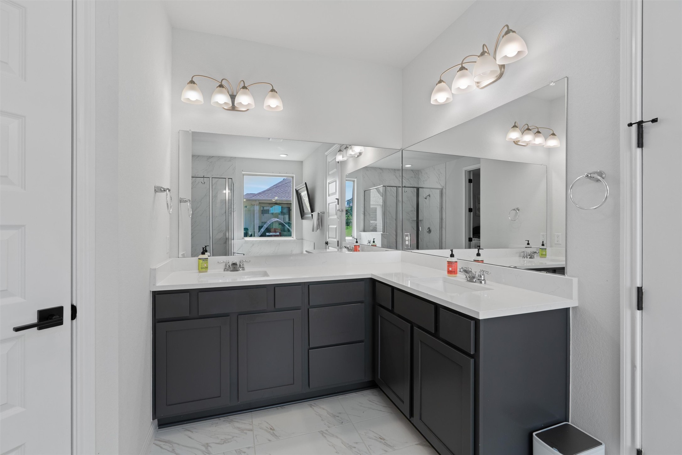 1908 Cabrera Drive Leander, TX 78641 - Photo 19 of 37 a bathroom with a double vanity sink and a mirror