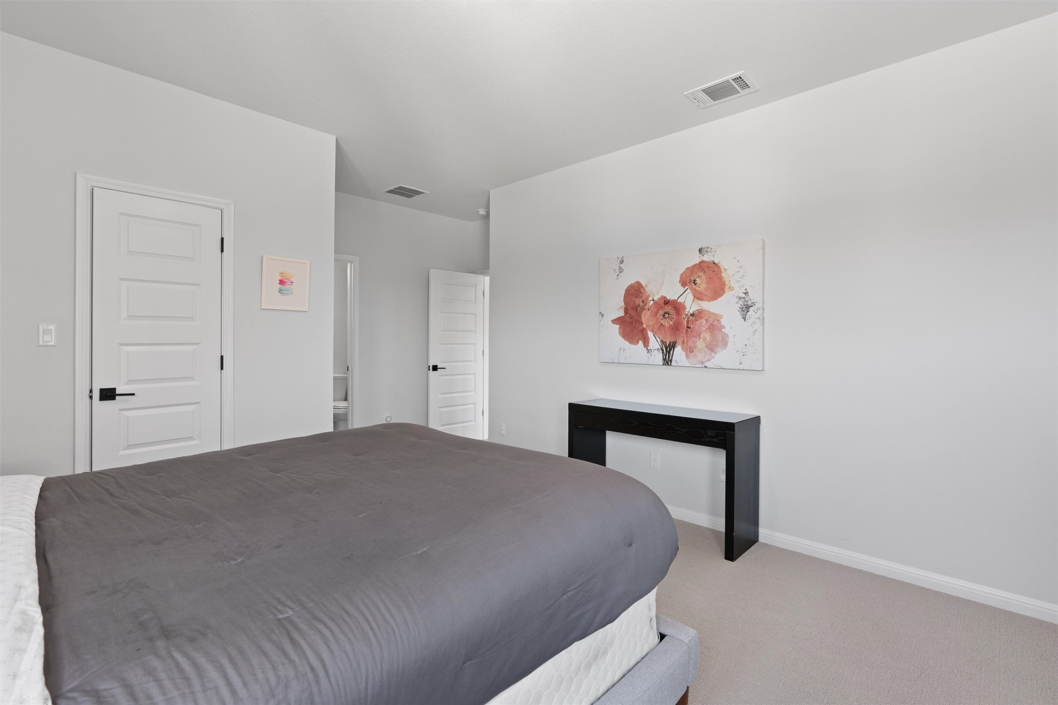 1908 Cabrera Drive Leander, TX 78641 - Photo 27 of 37 a bedroom with a bed and a painting on the wall