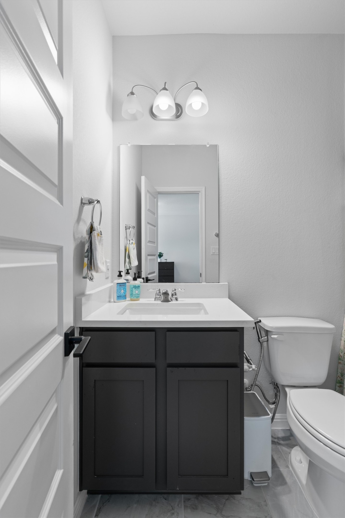 1908 Cabrera Drive Leander, TX 78641 - Photo 28 of 37 a bathroom with a toilet sink and mirror