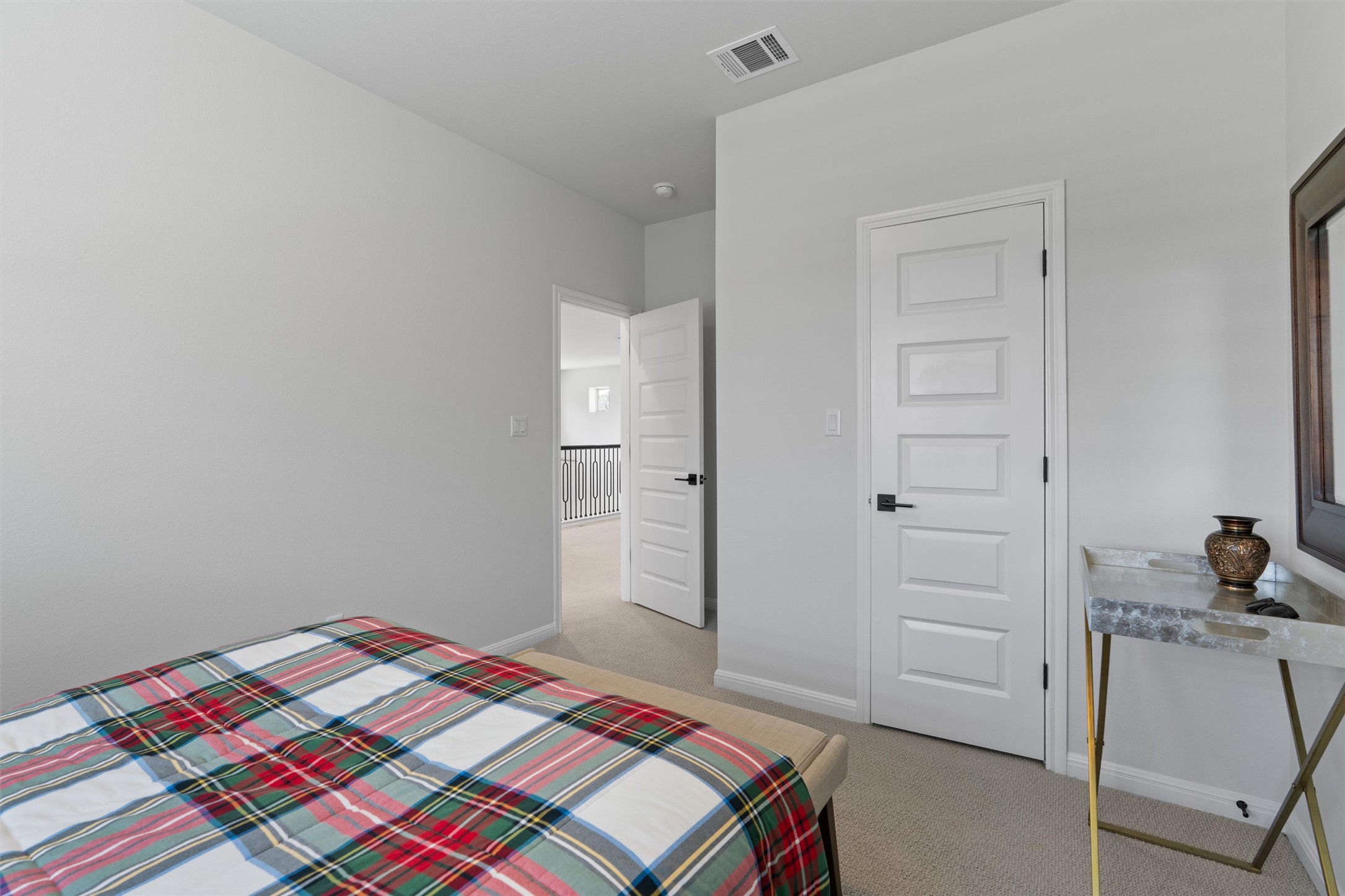 1908 Cabrera Drive Leander, TX 78641 - Photo 34 of 37 a bedroom with a bed and cabinets