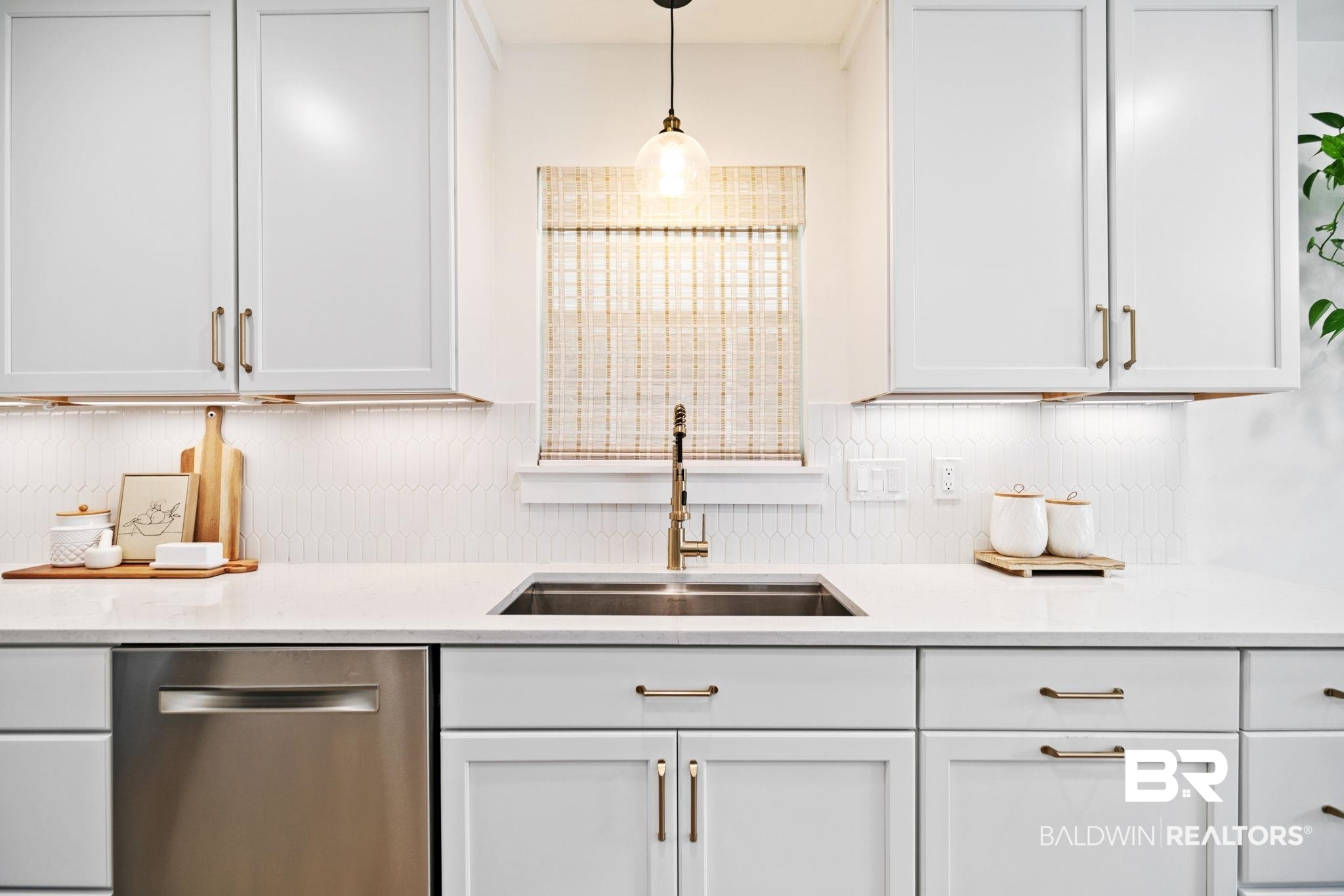 342 Ridgewood Drive Daphne, AL 36526 - Photo 5 of 36 Kitchen featuring sink, dishwasher, white cabinetry, and decorative light fixtures