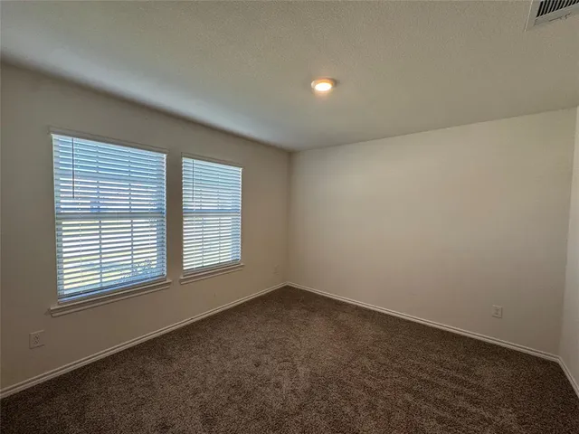 a view of a kitchen from the hallway