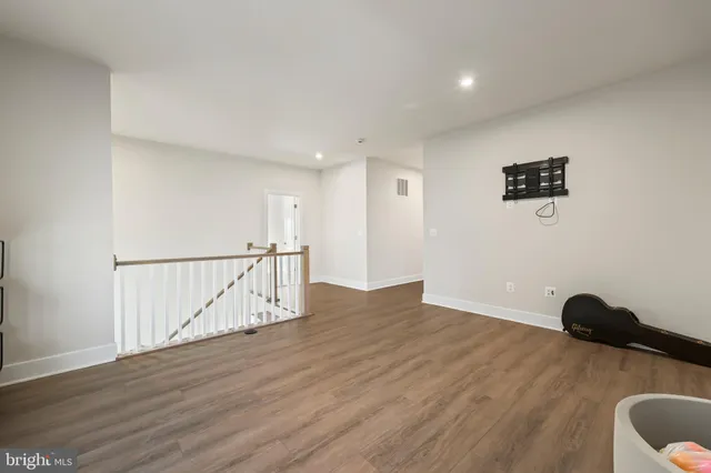 a view of entryway with wooden floor