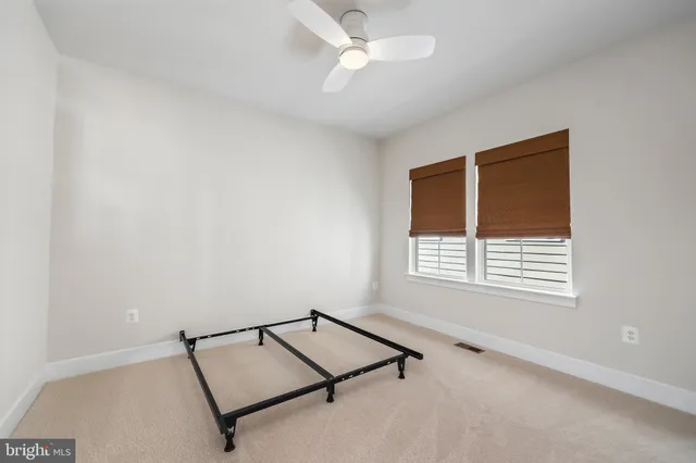 a room with window and ceiling fan