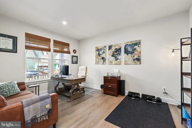 a living room with furniture window and a table