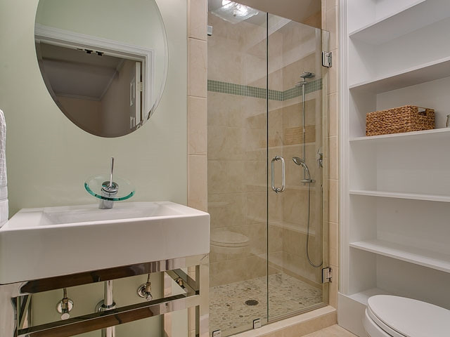 209 Avon Drive Raleigh, NC 27608 - Photo 13 of 20 Renovated master bath with awesome shower and built-in storage!