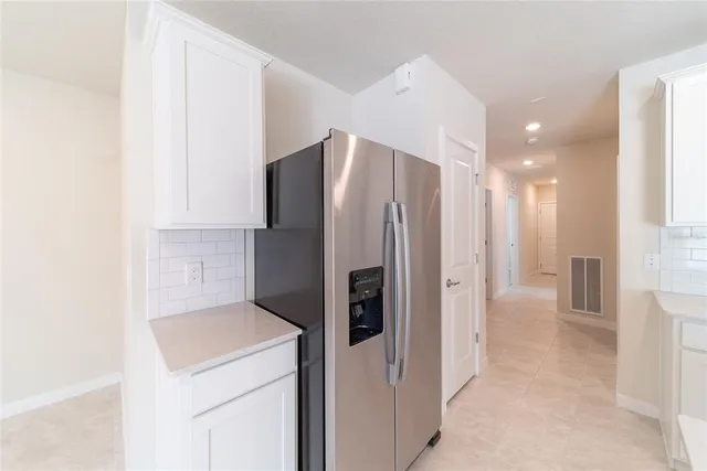 a kitchen with microwave a stove and a sink