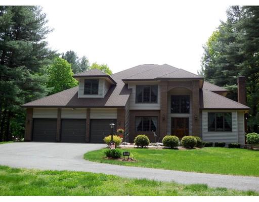 255 N Road Westfield, MA 01085 - Photo 1 of 30 a front view of a house with a garden and porch