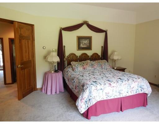 255 N Road Westfield, MA 01085 - Photo 16 of 30 a bedroom with a bed and a lamp on table