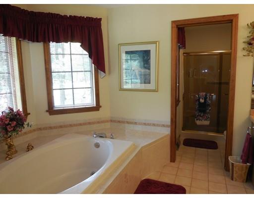 255 N Road Westfield, MA 01085 - Photo 19 of 30 a bath tub sitting in a bathroom next to a window