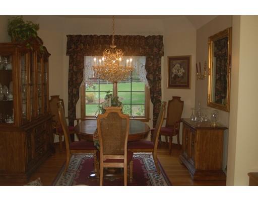 255 N Road Westfield, MA 01085 - Photo 7 of 30 a view of a dining room with furniture and chandelier