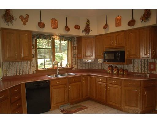255 N Road Westfield, MA 01085 - Photo 8 of 30 a kitchen with a sink a stove and cabinets