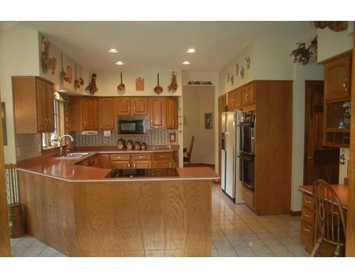 255 N Road Westfield, MA 01085 - Photo 9 of 30 a kitchen with stainless steel appliances a refrigerator and a sink
