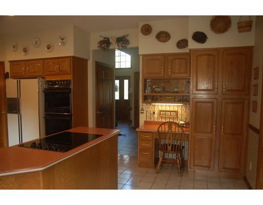 255 N Road Westfield, MA 01085 - Photo 10 of 30 a kitchen with a refrigerator and a cabinets
