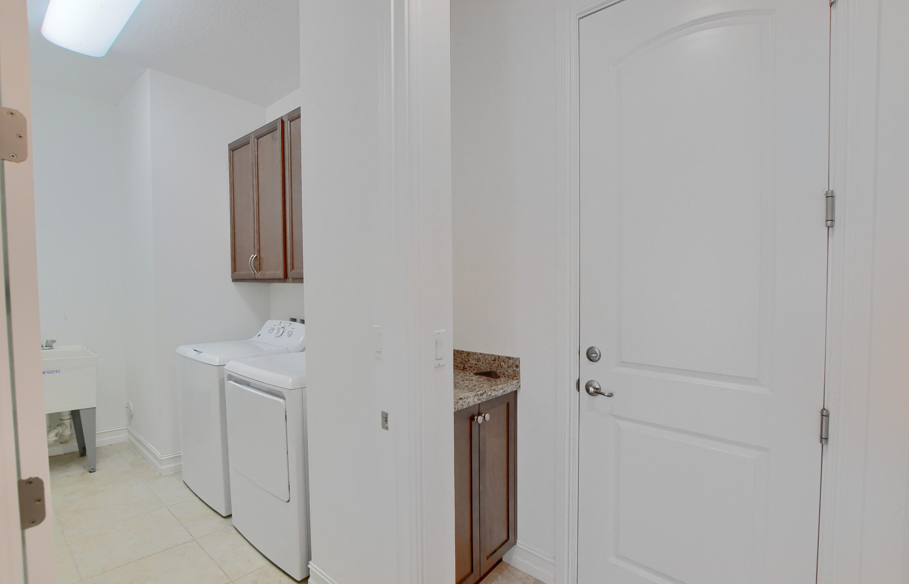 100 Northwest 69th Circle, Unit 15 Boca Raton, FL 33487 - Photo 27 of 45 Garage/Bath entry