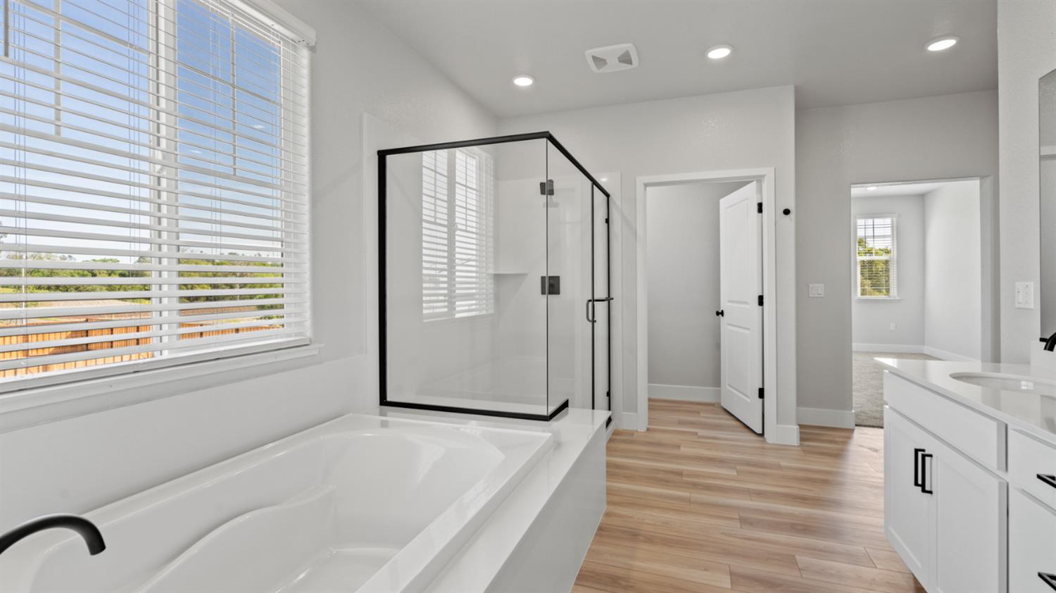 253 Rafters Court Lincoln, CA 95648 - Photo 11 of 14 a bathroom with a bathtub and a shower