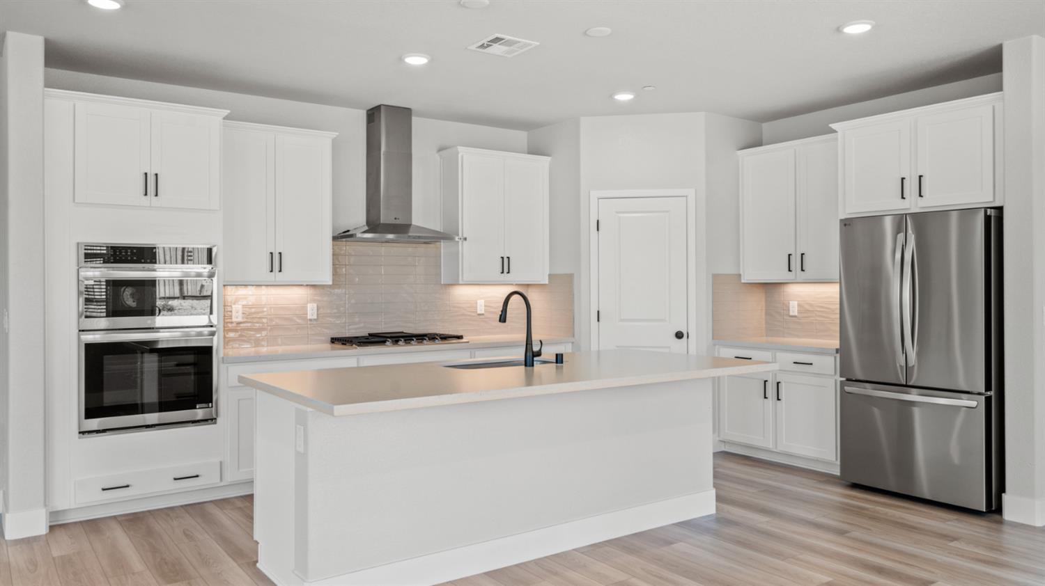 253 Rafters Court Lincoln, CA 95648 - Photo 4 of 14 a kitchen with kitchen island stainless steel appliances cabinets and a counter top space
